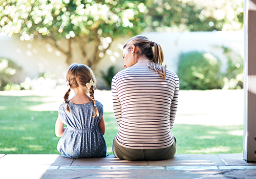 Mom and girl on porch