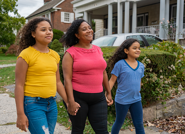 Mom and 2 daughters walking