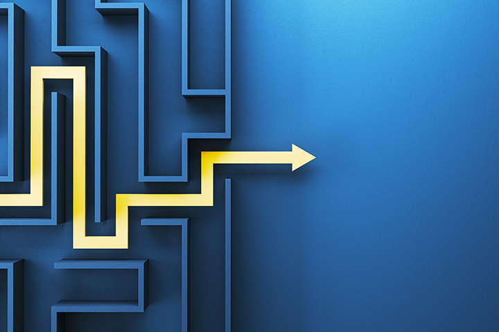 Blue maze with yellow line weaving through it representing decision making.