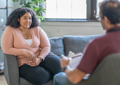 Piloting a patient navigator program to facilitate uptake and persistence with evidence-based weight loss interventions