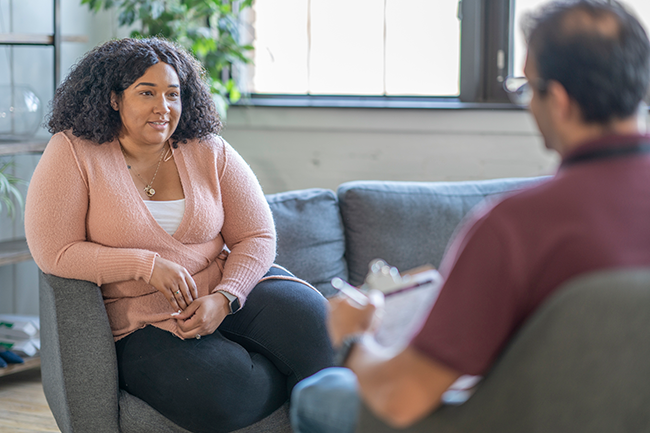 Piloting a patient navigator program to facilitate uptake and persistence with evidence-based weight loss interventions